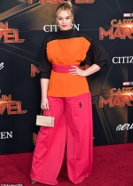 Iskra Lawrence catches the eye in bold colour block co-ords as she attends