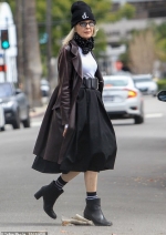 Diane Keaton, 73, opts for a punky look in a leather jacket, heeled boots