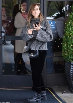 Jessica Alba cuts a casual figure in cosy grey jumper and velvet trousers