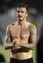 David Beckham debuts tiny heart tattoo on his ear as he attends