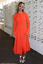 Zoe Saldana shows off her style credentials in an orange dress