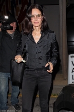 Courteney Cox is stylish in silky black blouse and skinny