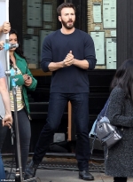 Chris Evans looks handsome in a navy sweater and jeans as he films scenes