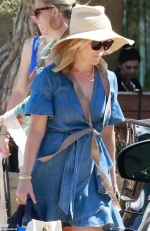 Reese Witherspoon wears denim dress and sun hat as she steps out hours