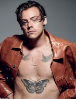 Harry Styles shows off his famous tattoos as he goes shirtless for edgy