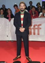 Shia LaBeouf goes bold in red stripes on the red carpet for the TIFF