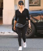 Eva Longoria shows off her toned figure in form-fitting black top