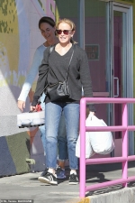Felicity Huffman brings some cupcakes as she arrives for community