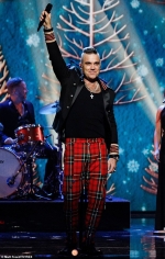Robbie Williams' festive album The Christmas Present looks set to top the UK charts...