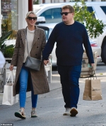 James Corden holds hands with wife Julia as they run errands in LA...