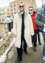 Jude Law goes for retro styling in funky tinted shades and a shearling