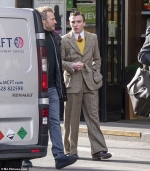 Rocco Ritchie emulates dad Guy's style as he steps out wearing a retro suit in London...