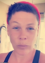 Pink trims her own locks during boozy night at home... after helping husband
