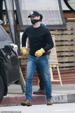 Colin Hanks dons a mask as he picks up food in LA after his dad Tom Hanks