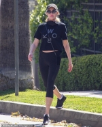 Melanie Griffith shows off trim figure and taut midriff in activewear