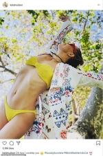 Kate Hudson flaunts her incredible physique in a canary yellow bikini