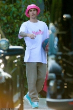 Justin Bieber reps his own music by donning Yummy shirt with pink bucket
