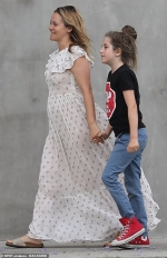 Alicia Silverstone looks cheerful as she holds hands with her nine-year-old son