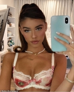Madison Beer flashes a seductive stare while flaunting her petite figure