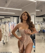 Kylie Jenner flaunts her curves in a pink corset bustier as she continues