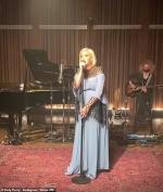 Pregnant Katy Perry puts on a soulful performance in a flowing light blue gown...