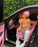 Kylie Jenner rocks a bubblegum pink Prada hat and a patterned tube top