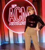 Taylor Swift wields an acoustic guitar and dons a sequin top for the world premiere performance