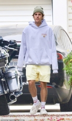 Justin Bieber oozes casual-cool in yellow shorts and hoodie as he heads back to the recording studio in LA...