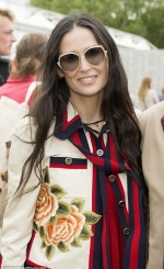 Demi Moore dresses the part in a rose-print jacket as she brings some Hollywood glamour