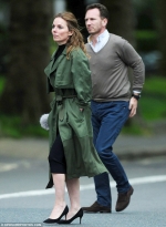 Geri Horner cuts a sophisticated figure in a chic emerald green trench coat