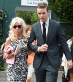 Will Poulter looks dapper in green suit as he treats his mother to a day