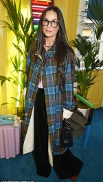 Demi Moore looks every inch the fashionista in quirky checked coat and funky glasses