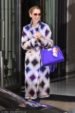 Celine Dion brightens up Paris in a colourful coat and matching handbag