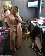 Braless Nicki Minaj shows off her naked breasts as she wears nothing but a silk