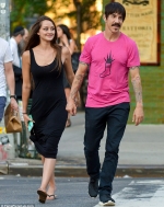Red Hot Chili Peppers' Anthony Kiedis holds hands with a young mystery brunette while out in NYC