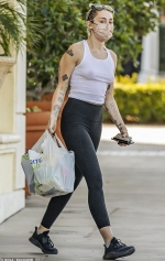 Miley Cyrus leaves little to the imagination as she goes braless in white tank top for drug store