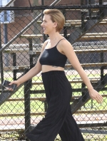 Scarlett Johansson shows some skin in tiny crop top and very high-waisted trousers
