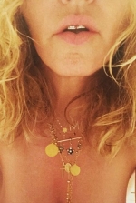 Madonna follows fellow pop star's lead as she posts NUDE selfie while backing