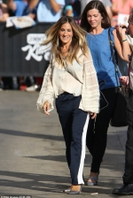 Sarah Jessica Parker opts for comfortable style in striped trousers and billowy blouse