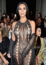 Kim Kardashian leaves NOTHING to the imagination by going underwear-free in a barely-there mesh catsuit as she leads the glamour