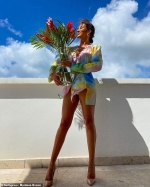 Love Island's Montana Brown puts on a VERY leggy display in a colourful shirt dress and heels as she celebrates