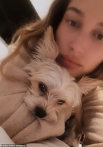 Hailey Bieber snuggles with her dog Oscar as she shares some gorgeous