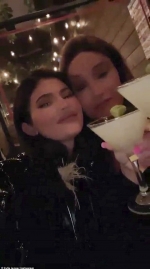 Kylie Jenner clanks glasses with father Caitlyn as they enjoy their weekly dinner together