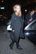 Pregnant Amanda Seyfried shows off her growing baby bump in a casual jumper