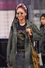 Rihanna cuts a casual figure in military chic ensemble and dreadlocks
