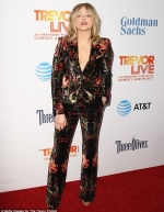 Chloe Moretz shows off her edgy sense of style as she suits up in a bold flora