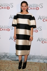 Pregnant Marion Cotillard slips her blossoming bump into chic striped shift dress