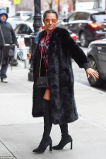 Mel B puts on a leggy display in sexy thigh-high boots and a lavish fur coat as she steps