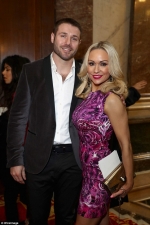 Kristina Rihanoff shows off her athletic post-baby figure in daring puce mini-dress as she cozies up to Ben Cohen
