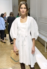 Fashionista Alexa Chung covers up in a demure peasant-style dress teamed